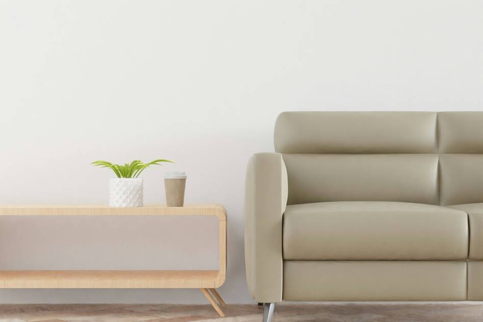 Minimalist living room with neutral tones, sleek sofa, and wooden accents