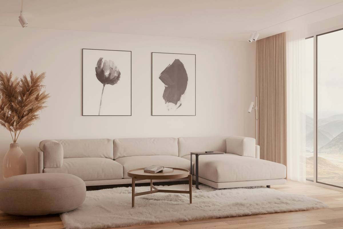minimalist interior design tips: a serene living room with a neutral-toned sofa, wooden coffee table, and single potted plant