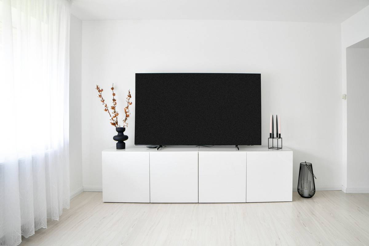 minimalist interior design styles featuring a light-filled living room with a low-profile sofa, wooden coffee table, and uncluttered walls