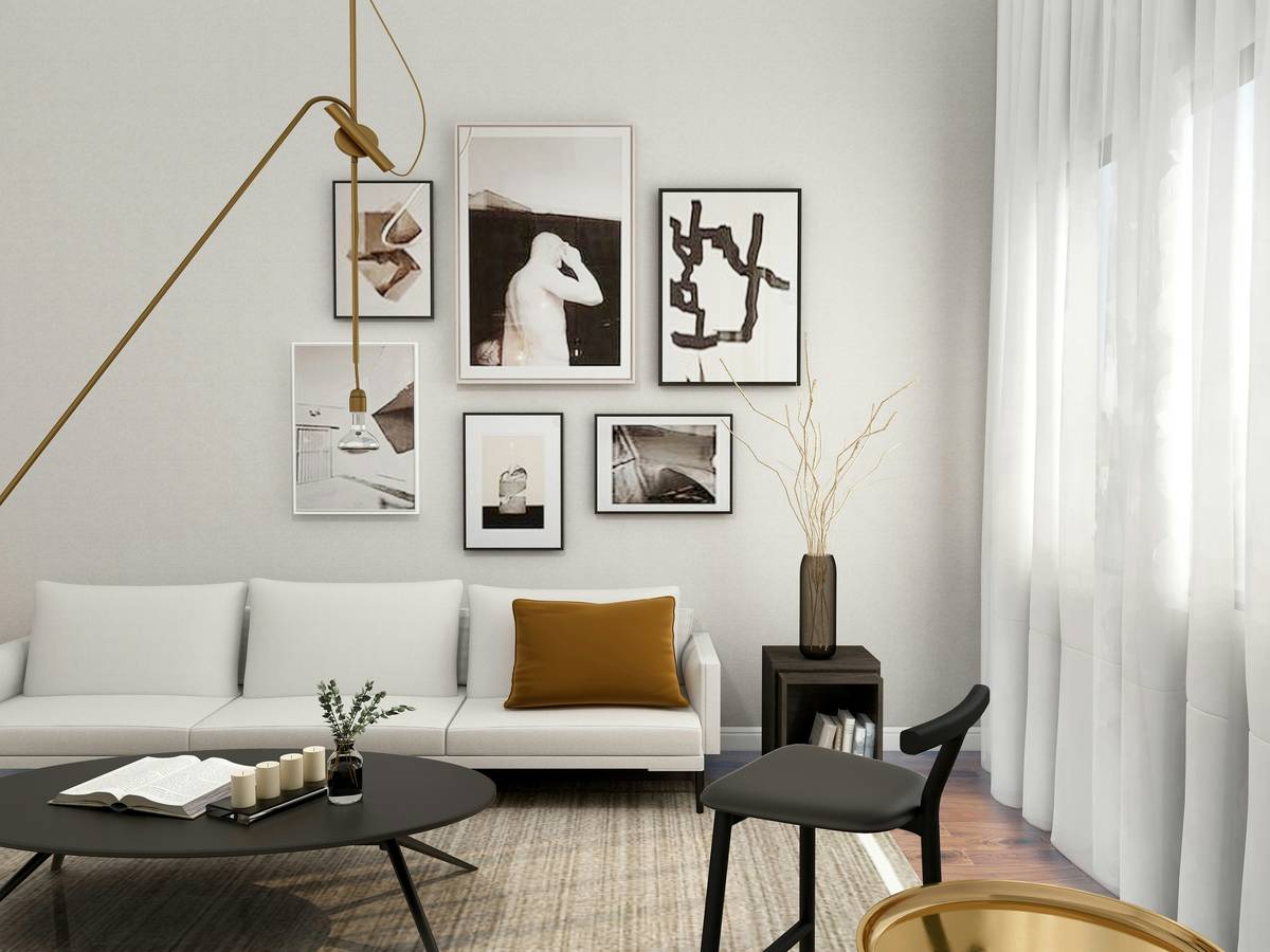 what is minimalist decorating style illustrated with a tidy living room featuring a low-profile sofa, wooden coffee table, and empty floor space